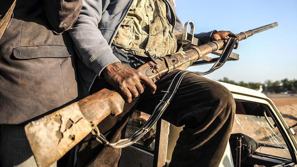 A man holding a gun