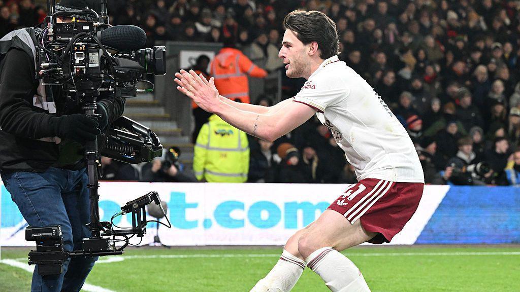 Declan Rice celebrates an Arsenal goal by running to a camera