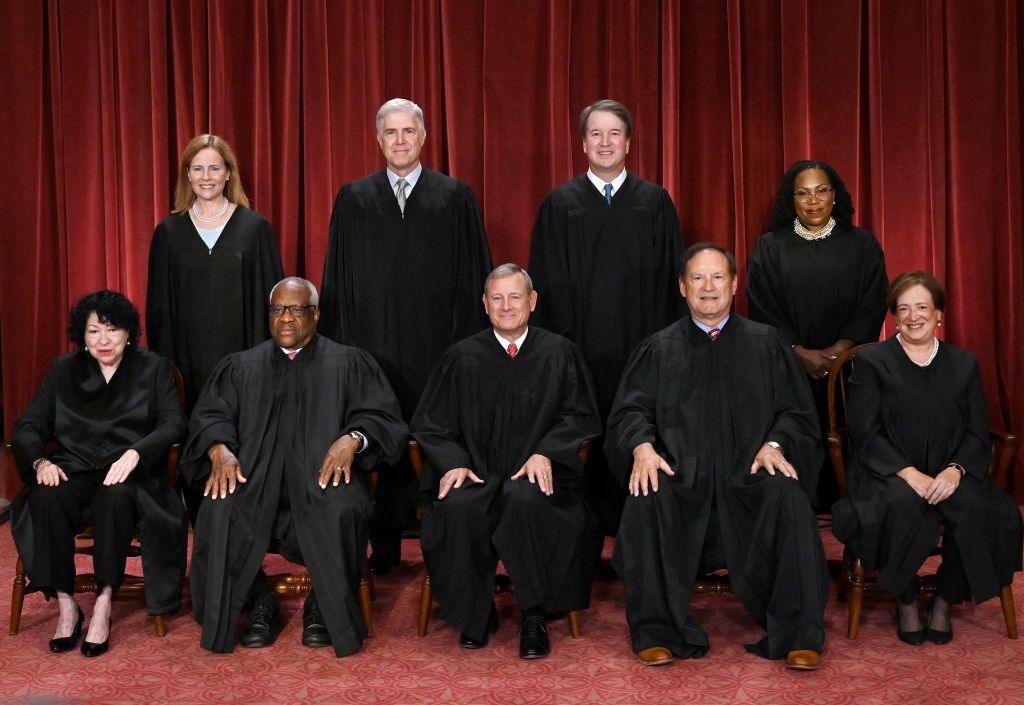 Sitting (L-R): Sonia Sotomayor, Clarence Thomas, John Roberts, Samuel Alito and Elena Kagan; Standing (L-R) Amy Coney Barrett, Neil Gorsuch, Brett Kavanaugh and Ketanji Brown Jackson