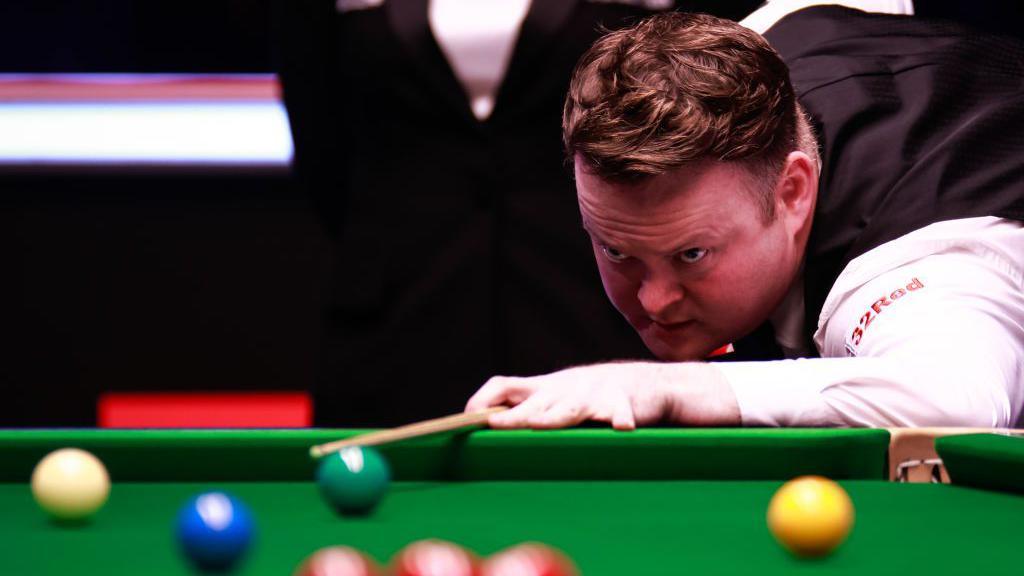 Shaun Murphy of England plays a shot