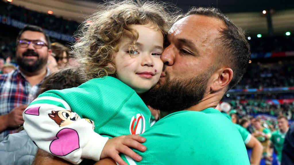 Jamison Gibson-Park celebrates the Stade de France victory with daughter Iris