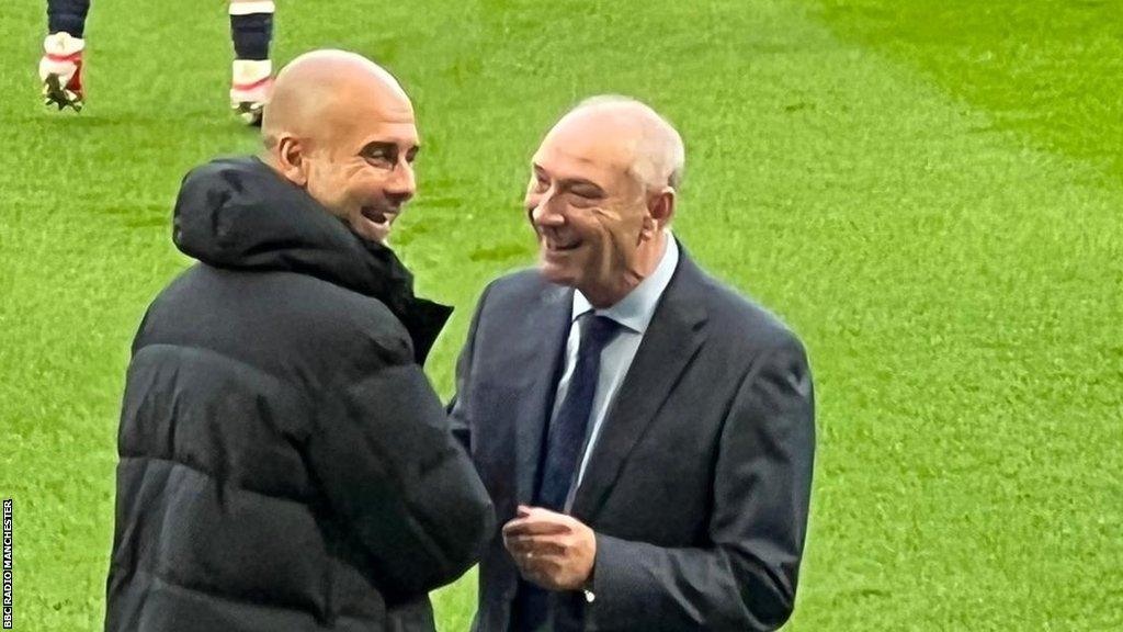 Manchester City boss Pep Guardiola (left) greets Brian Horton (right)