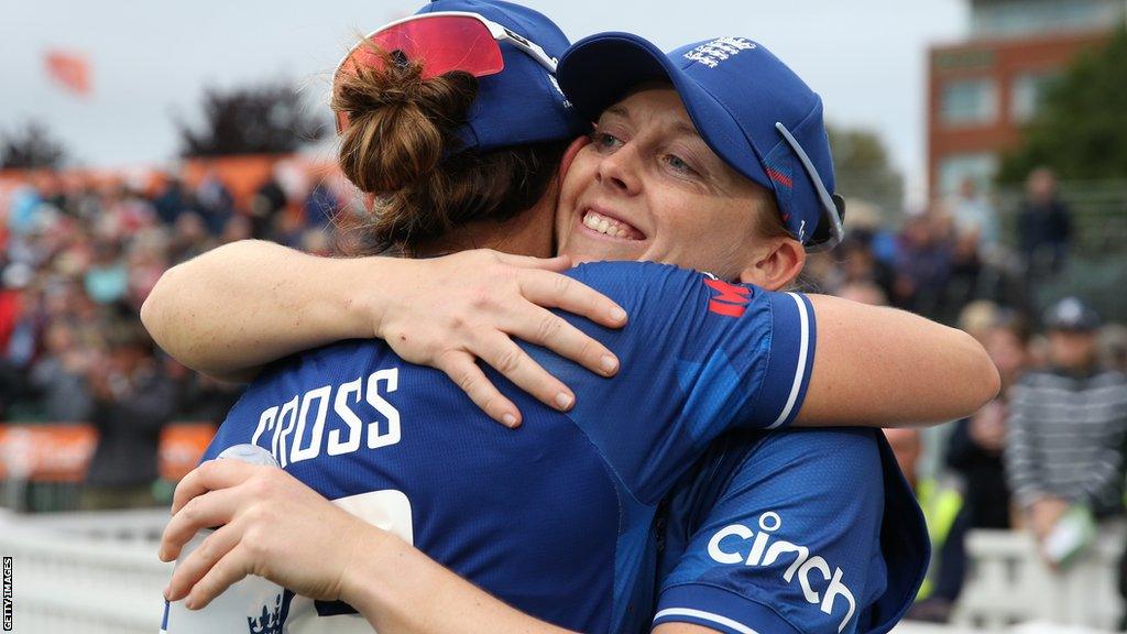 England captain Heather Knight and bowler Kate Cross hug