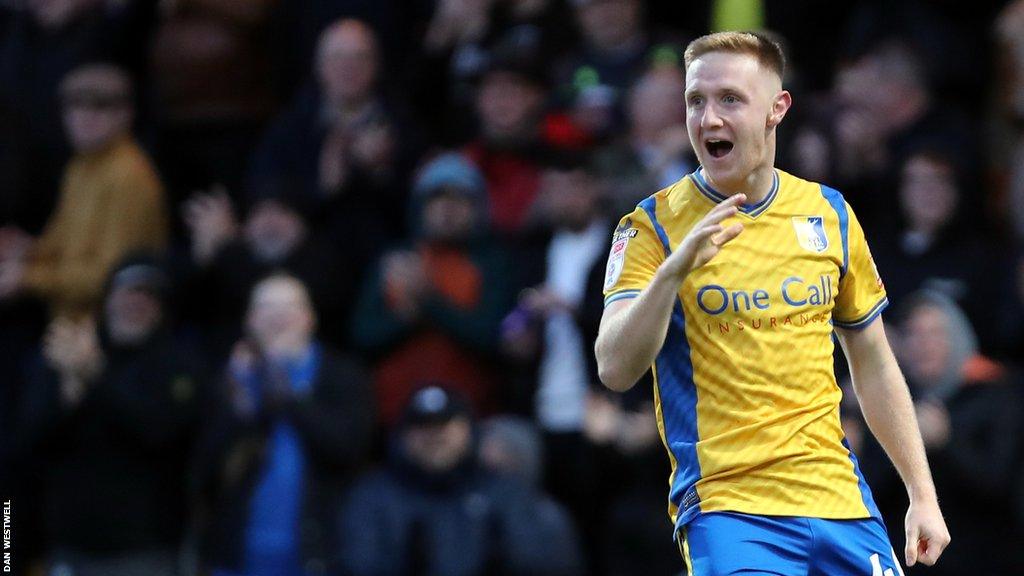 Davis Keillor-Dunn celebrates scoring for Mansfield against Newport