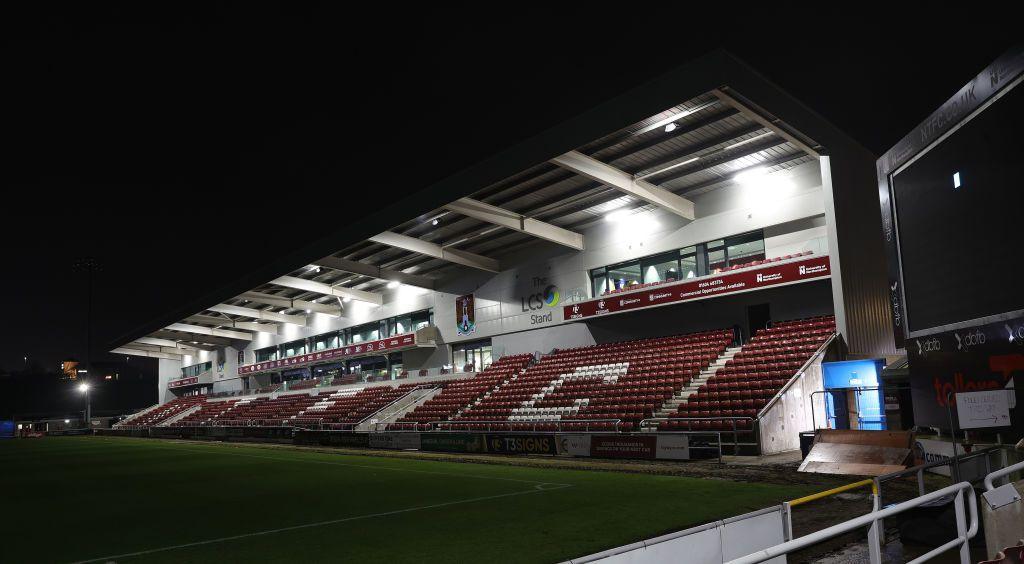 The new East Stand illuminated in flood lights at night. 