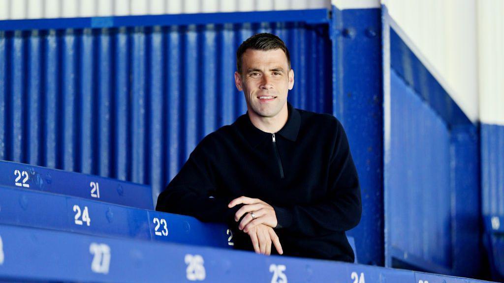 Seamus Coleman poses for a photo after signing a new contract with Everton at Goodison Park on June 12, 2024