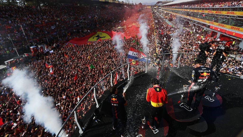 Sergio Perez, Carlos Sainz and Max Verstappen celebrate on the Monza podium in 2023 