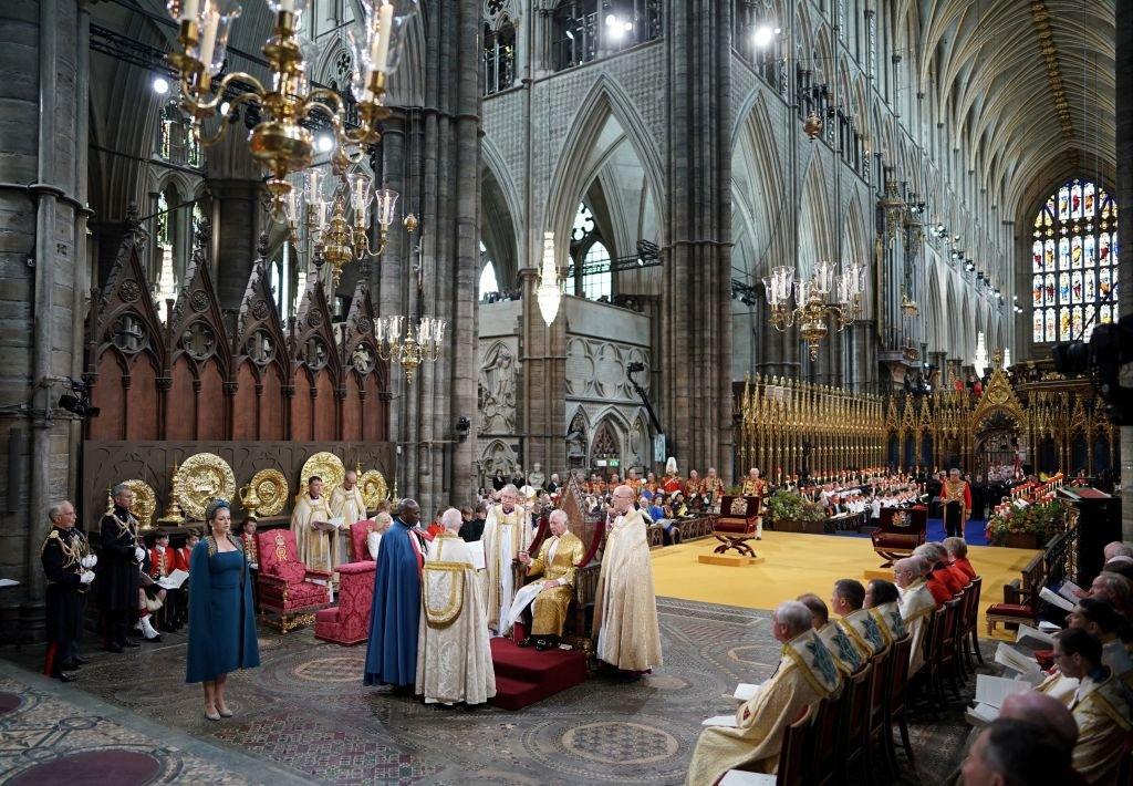 Britain's King Charles III holds the Sword of State during the Coronation Ceremony inside Westminster Abbey in central London, 6 May 2023