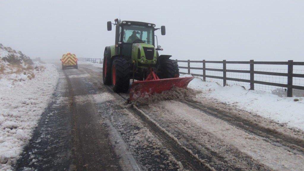 Rhondda Cynon Taf council workers clearing snow off the roads