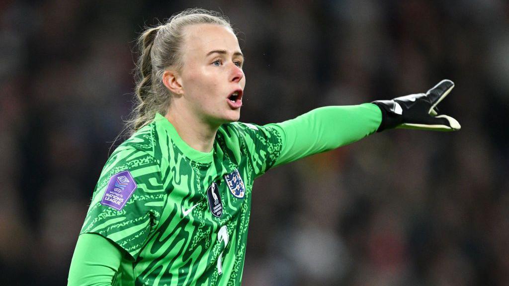 England goalkeeper Hannah Hampton signals to her team-mates