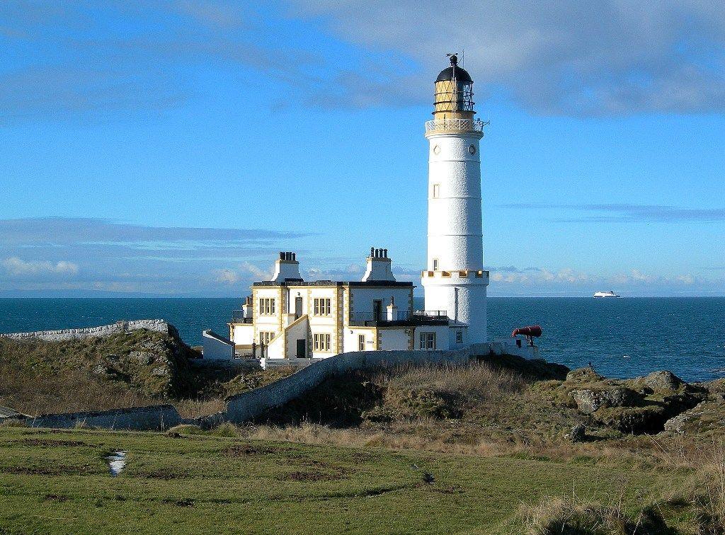 A picture of Corsewall lighthouse in Dumfries and Galloway a white and yellow building looking out to the sea