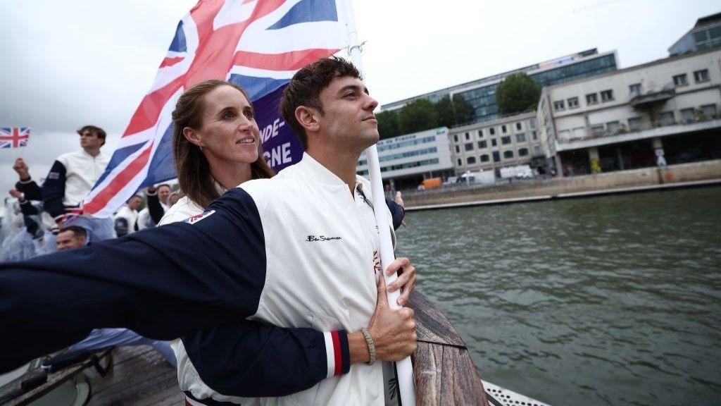 Helen Glover puts her arms round Tom Daley in a recreation of a scene from Titanic