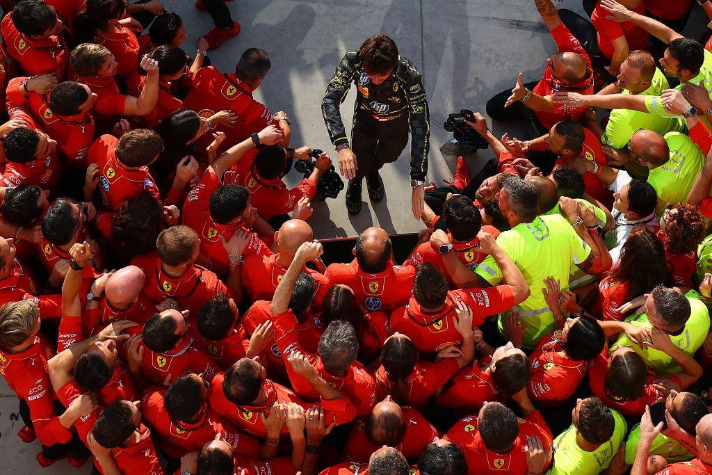 Charles Leclerc is greeted by his team after winning the Monza grand prix