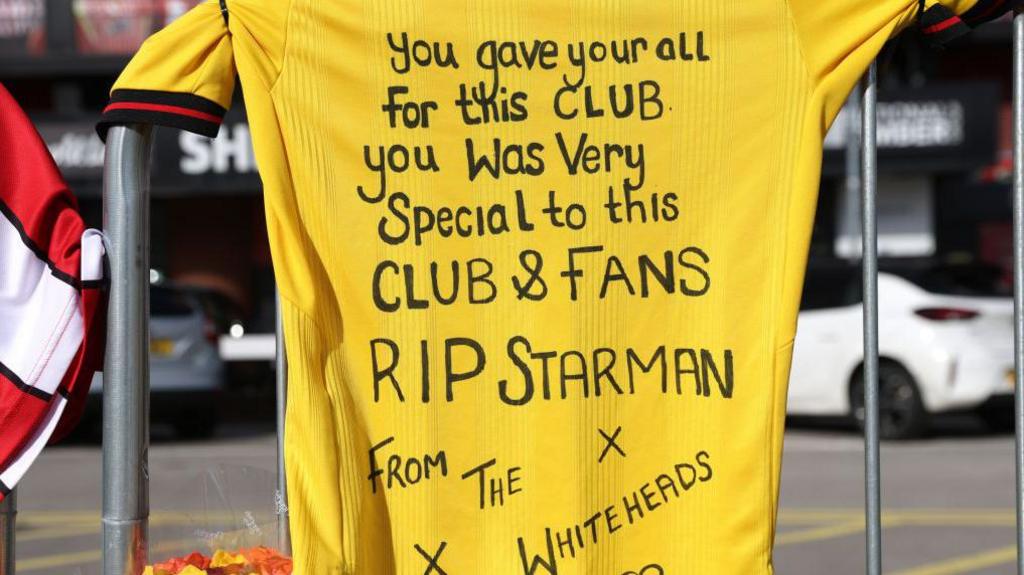 Tributes to George Baldock, called 'Starman' by some Sheffield United fans, were laid outside Bramall Lane on Thursday - including a football shirt with a message from fans