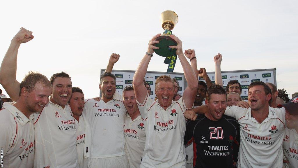 Lancashire captain Glen Chapple lifts the County Championship trophy in 2011