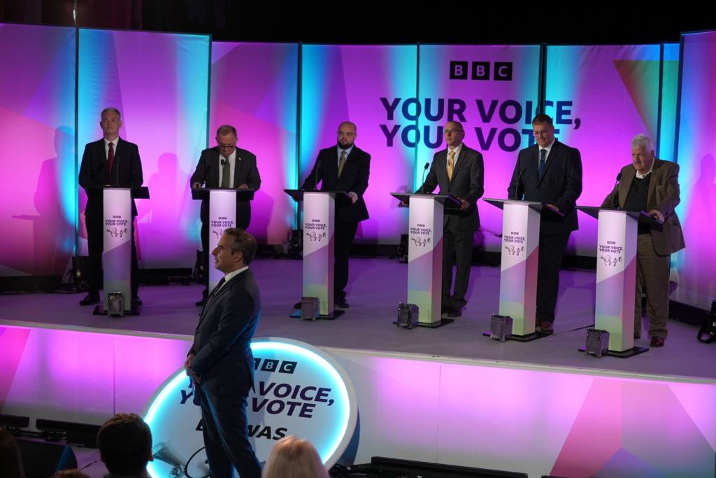 Candidates at their podiums for the debate