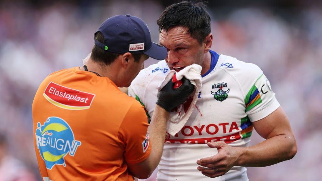 Jordan Rapana of the Raiders receives medical attention during the round 26 NRL match between Sydney Roosters and Canberra Raiders at Allianz Stadium, on September 01, 2024, in Sydney, Australia.