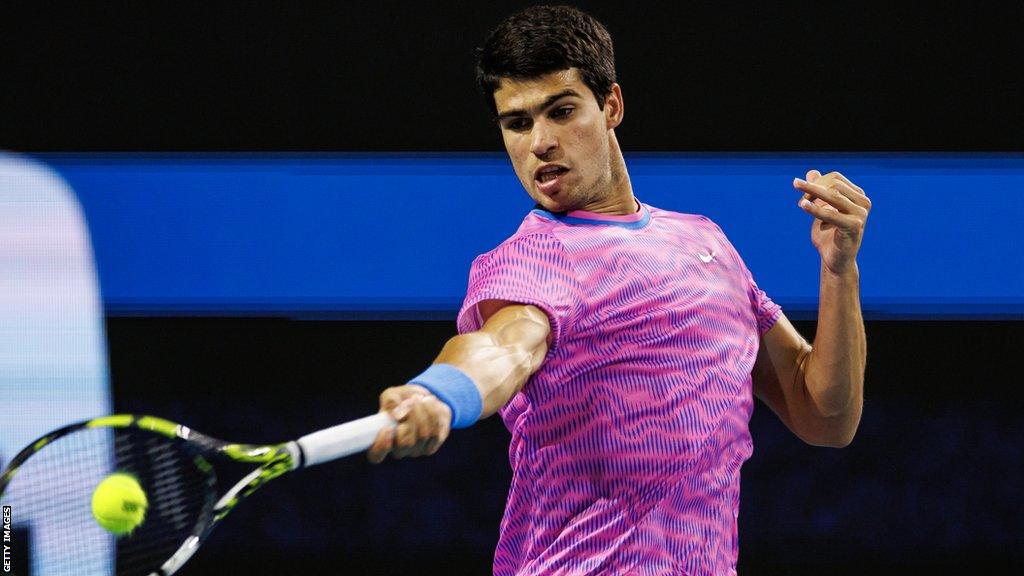 Carlos Alcaraz plays a shot against Gael Monfils