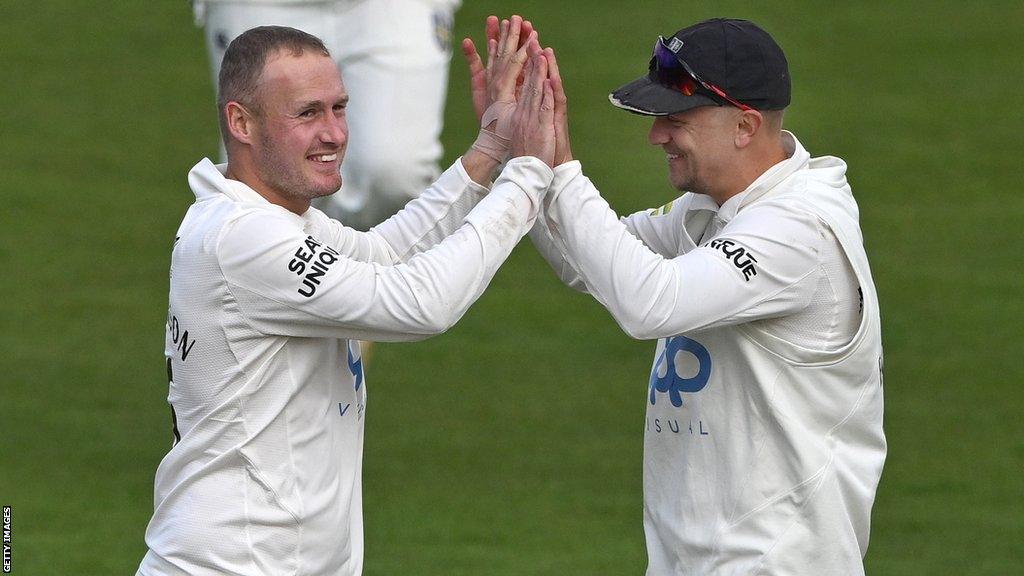 Matt Parkinson celebrating with Durham captain Scott Borthwick