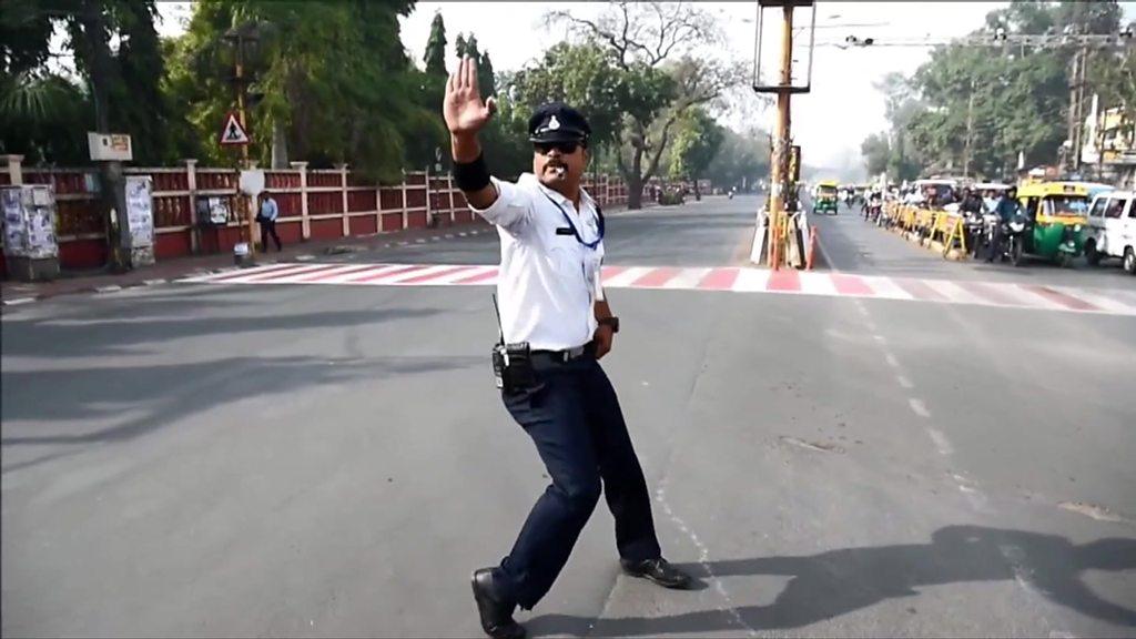 Traffic cop Ranjeet Singh uses moonwalking and dance moves to manage traffic in Indore, India.