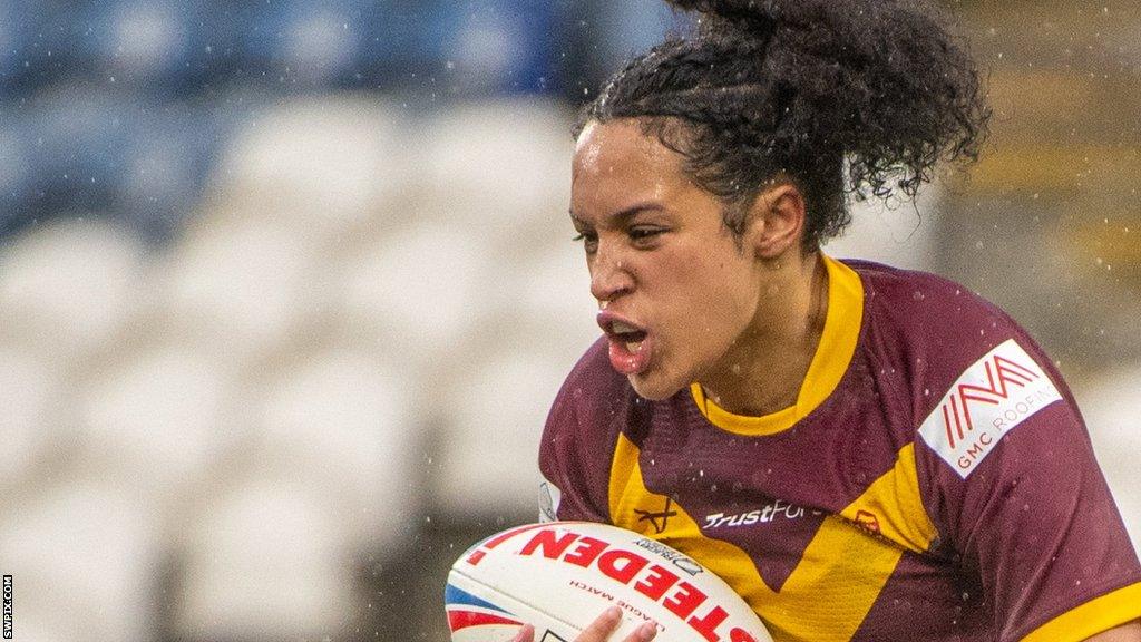 Amelia Brown takes a tackle for Huddersfield