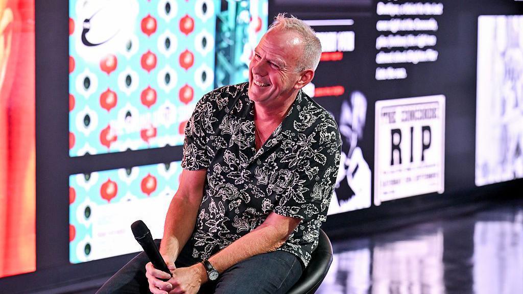 Norman Cook, also known as Fatboy Slim, speaks during the "It Ain't Over Until The Fatboy Sings" Book Launch