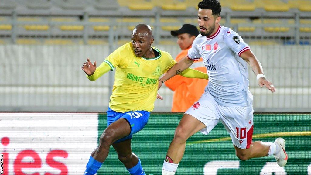 Wydad's Ayman el-Hassouni (right) fights for the ball with Sundowns' Khuliso Mudau