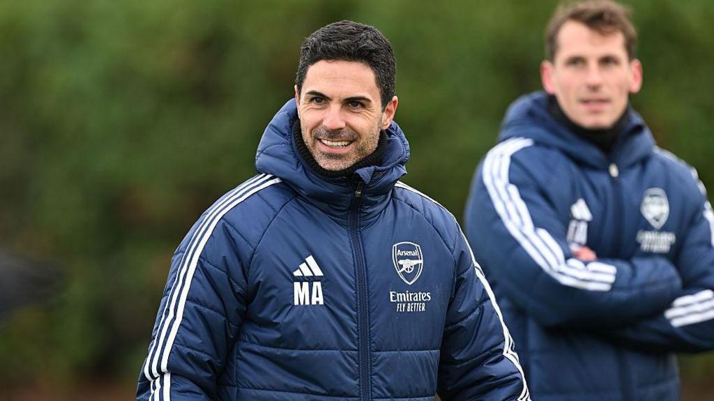 Mikel Arteta smiling during an Arsenal training session