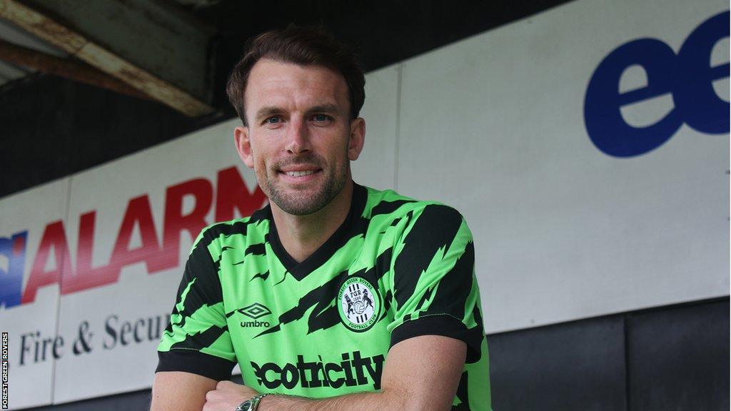 Christian Doidge in a Forest Green shirt