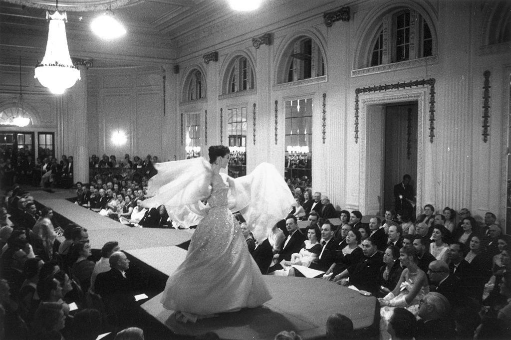 'Lucky; one of Christian Dior's models wearing an embroidered ball gown at a fashion show raising money for the Friends of France