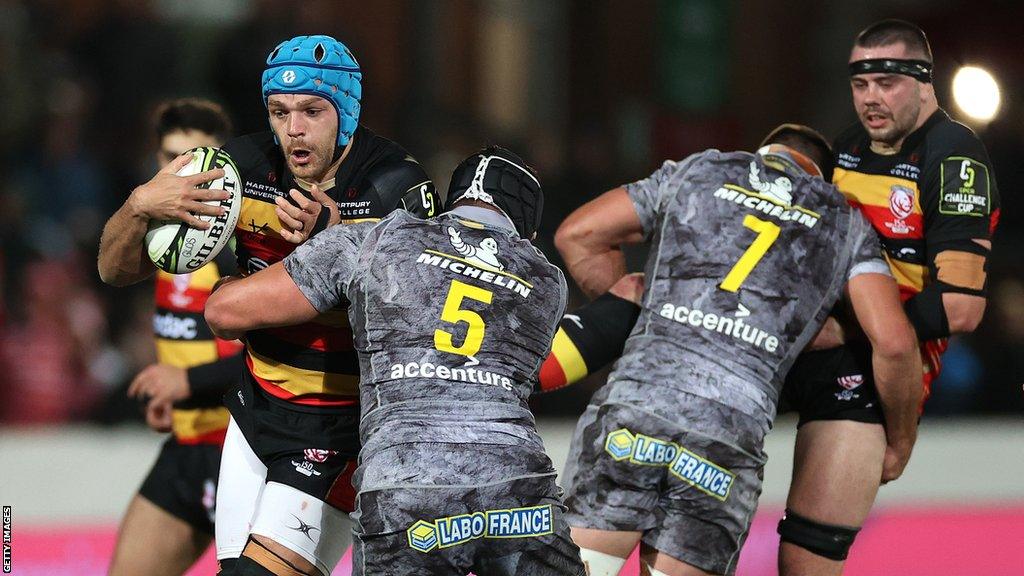 Gloucester's Zach Mercer carries the ball against Clermont Auvergne