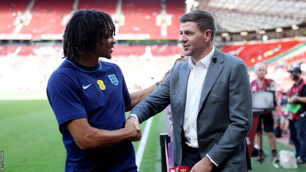 Steven Gerrard shakes hands with Trent Alexander-Arnold before England's game against North Macedonia at Old Trafford