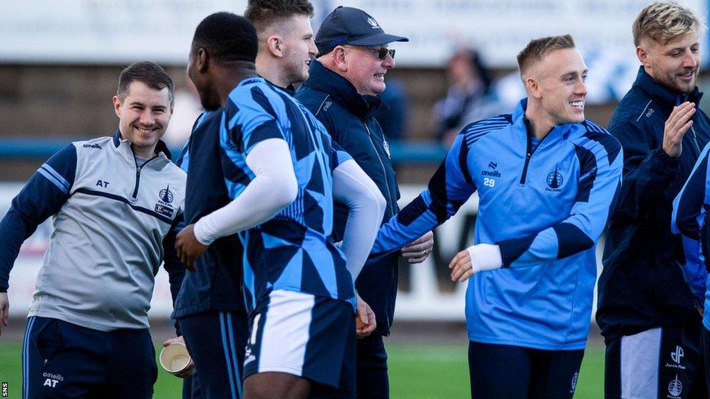 Falkirk players and manager John McGlynn celebrate their League One title win