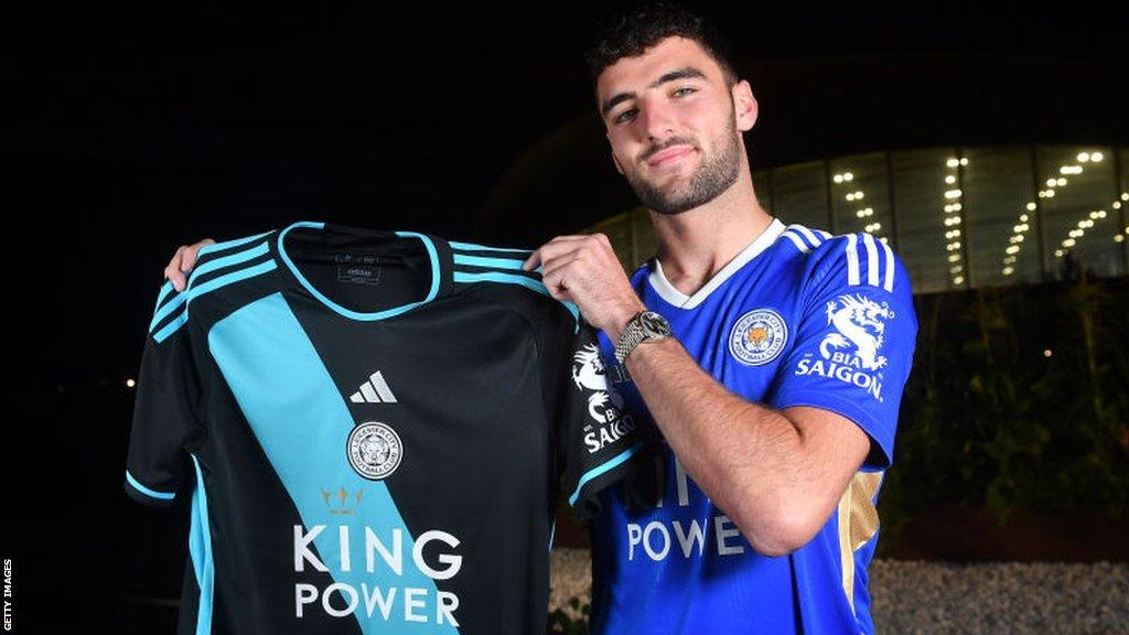 Tom Cannon posing with a Leicester City shirt