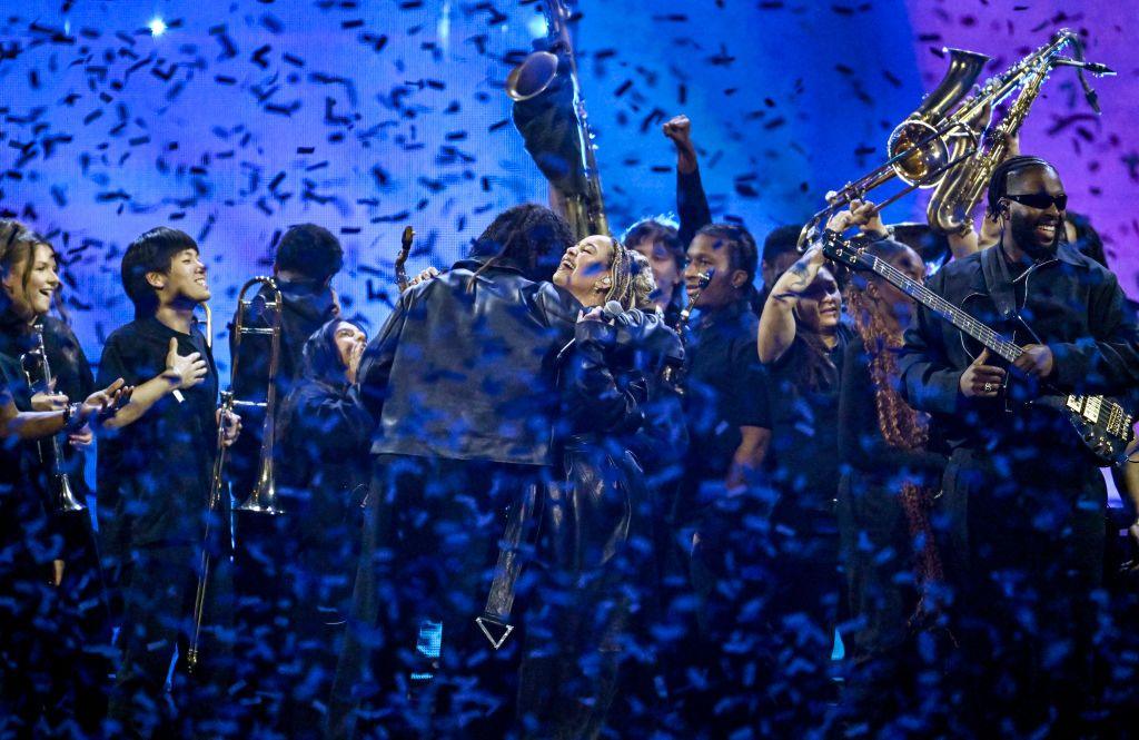 Ezra Collective perform on stage during The BRIT Awards.