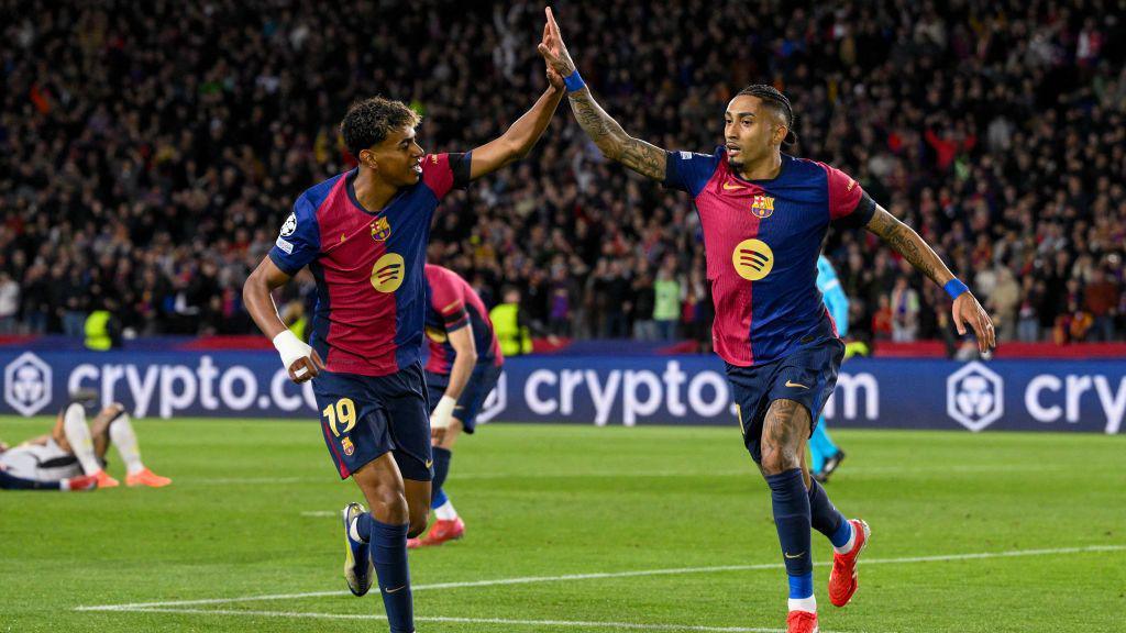 Lamine Yamal and Raphina celebrate for Barcelona against Benfica 