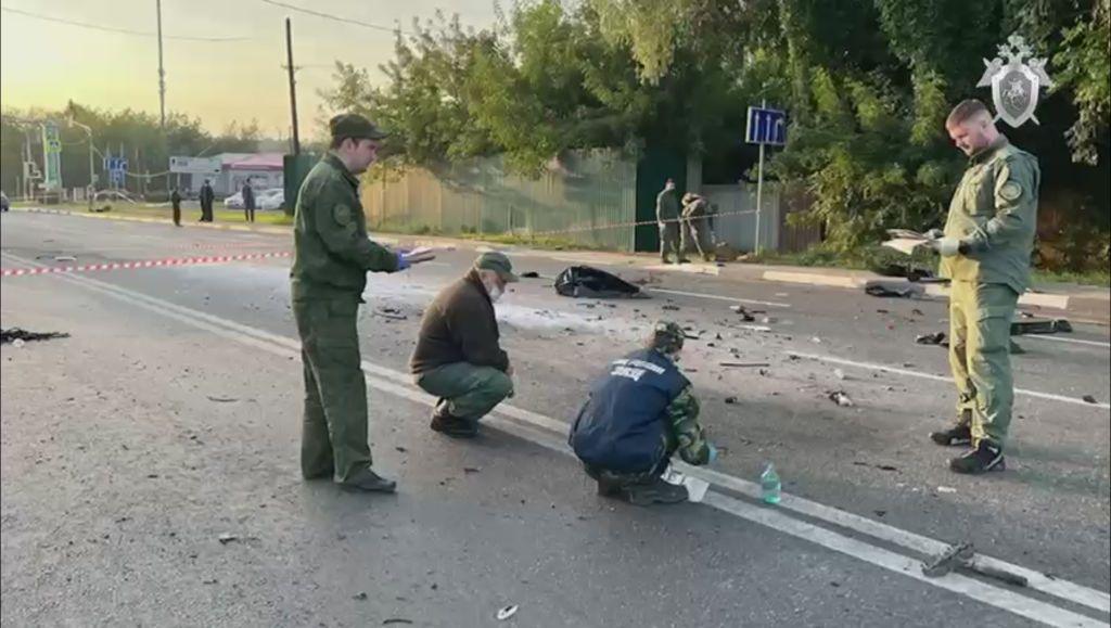 Russian police search a street near Moscow after the killing of a Russian nationalist's daughter, Darya Dugina