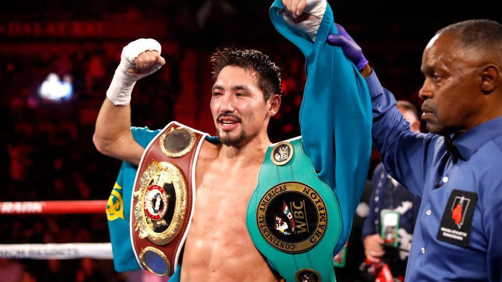 Janibek Alimkhanuly celebrates after beating Hassan N'Dam N'Jikam in 2021