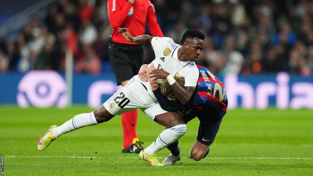 Vinicius Jr and Frenkie De Jong grapple at the Bernabeu