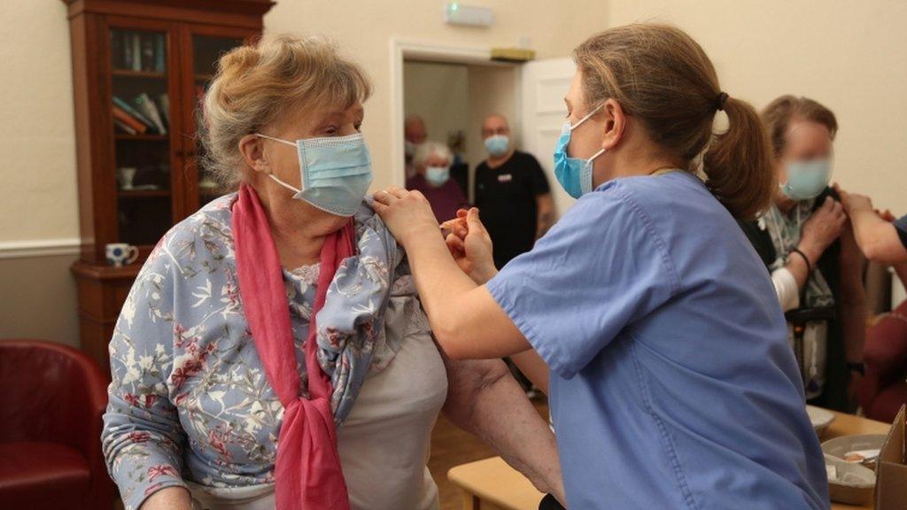 lady getting vaccine