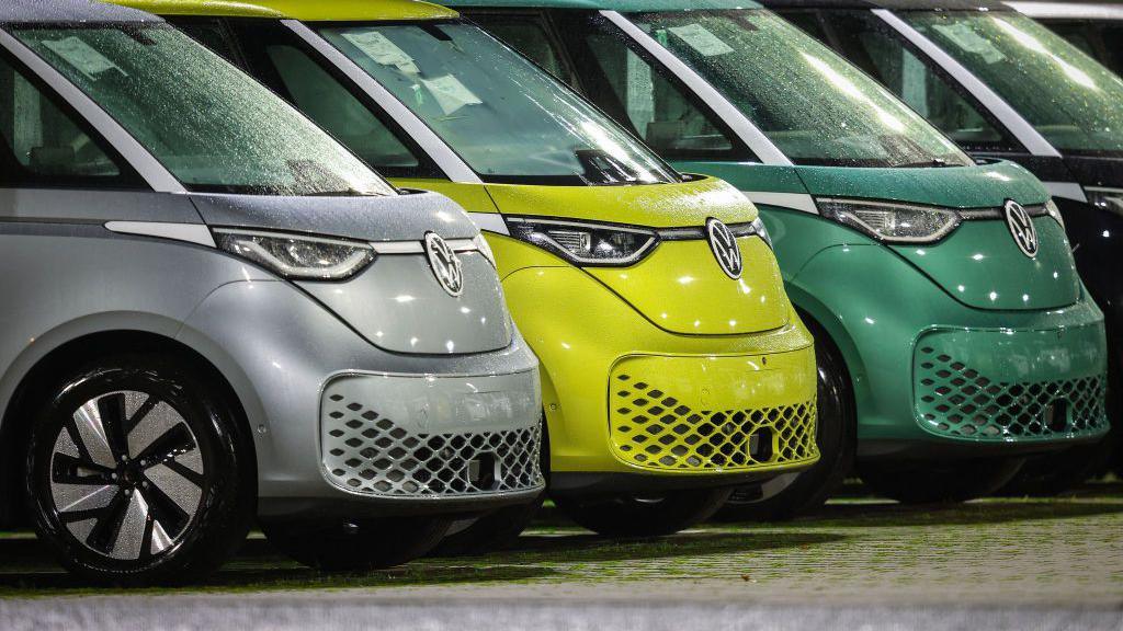 New VW ID Buzz vehicles, fully electric-driven microbus from Volkswagen Commercial Vehicles, are seen parked next to the commercial vehicle plant of German car manufacturer Volkswagen.