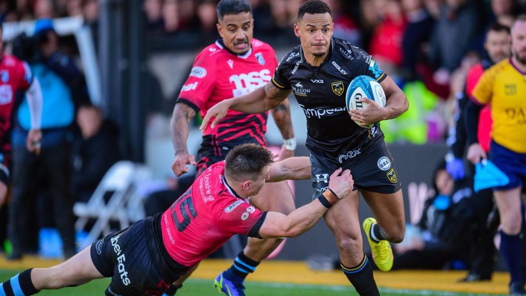 Ashton Hewitt tries to break away for Dragons against Cardiff