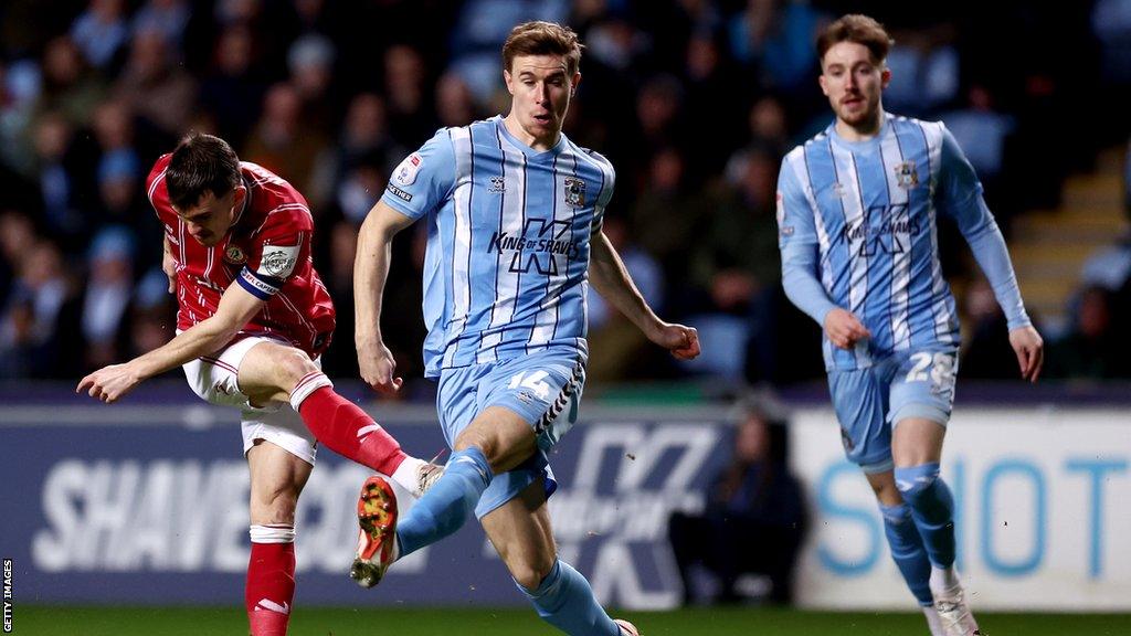 Coventry City's Ben Sheaf (centre) puts pressure on Bristol City's Jason Knight