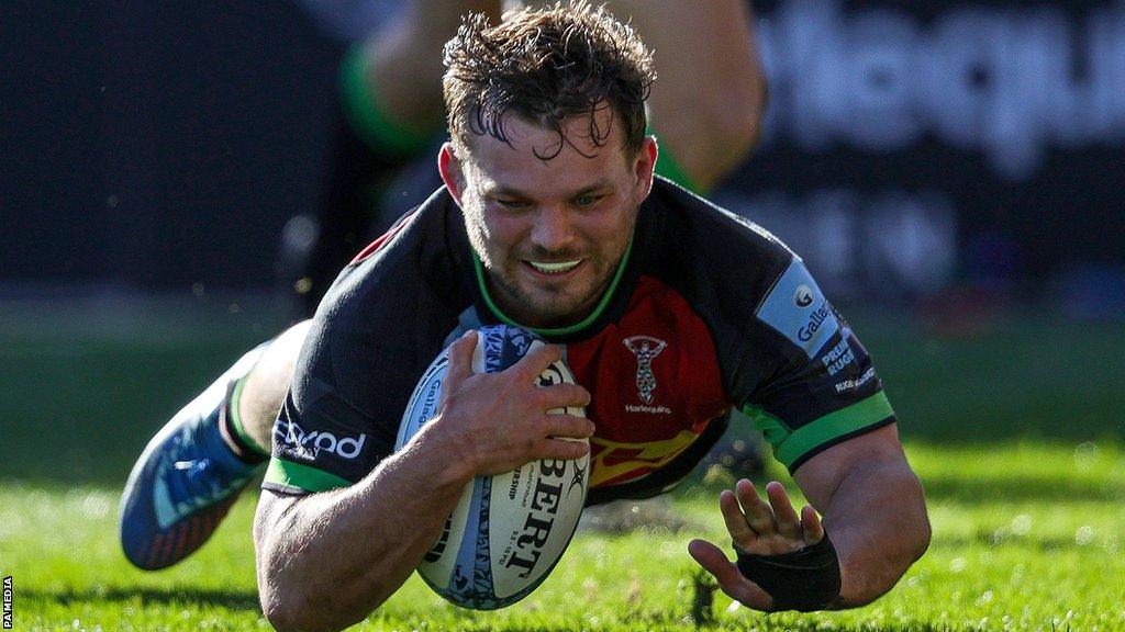 Will Evans dives to score a try for Harlequins