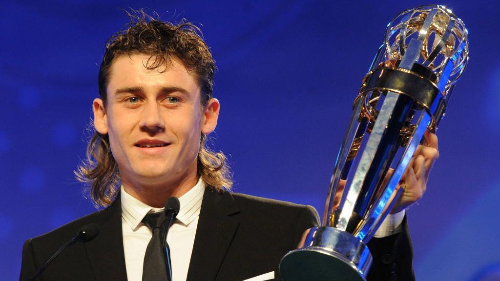 Server Djeparov of Uzbekistan holds up the trophy after winning the Asian Football Confederation (AFC) Player of the Year award in November 2008