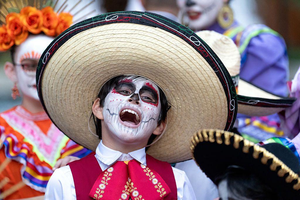 boy in a traditional Dia de los Muertos costume