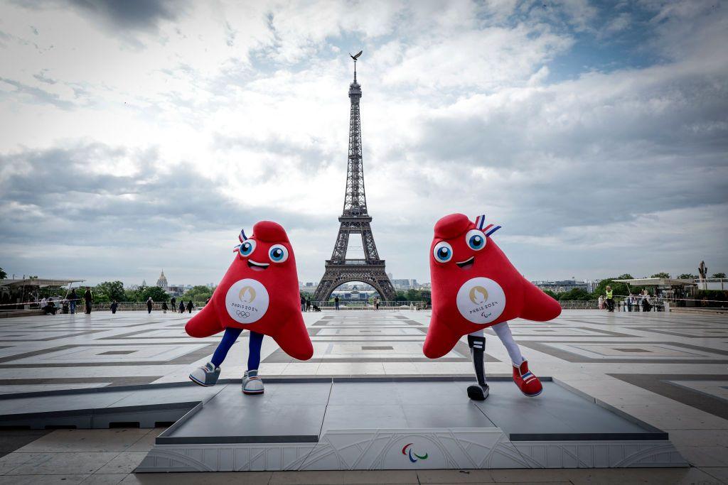 Olympic and Paralympic mascots "the Phryges" in front of the Eiffel Tower 