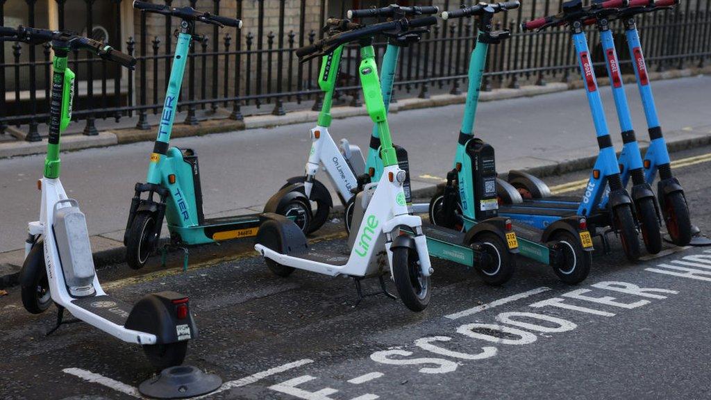 Scooters in parking bay