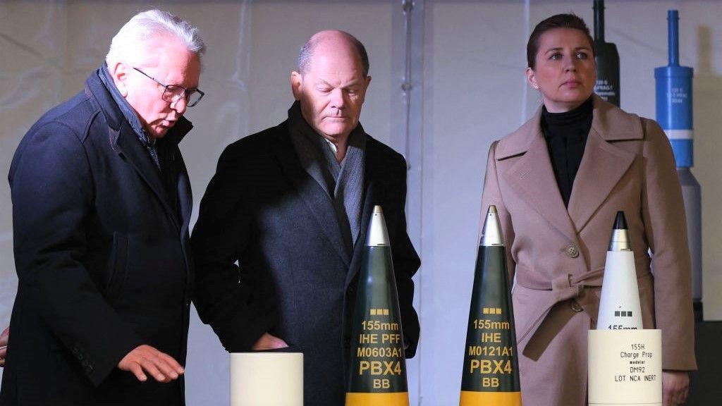 CEO of Rheinmetall AG Armin Papperger (L) talks to German Chancellor Olaf Scholz next to Danish Prime Minister Mette Frederiksen at the future site of an ordnance factory where German arms manufacturer Rheinmetall plans to start production from 2025, in Unterluess, Germany on February 12, 2024