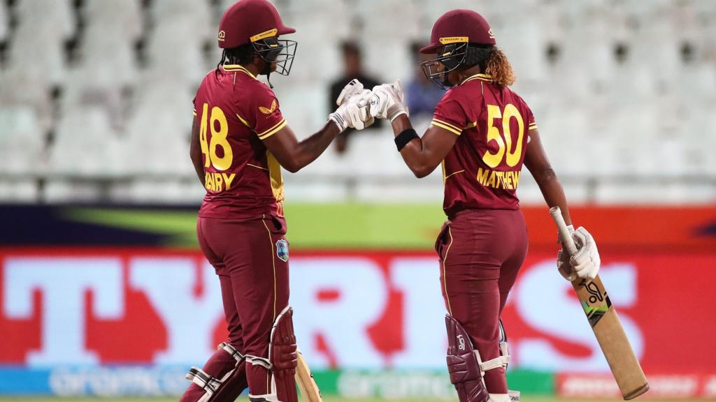 Hayley Matthews of West Indies celebrates their half century with Chinelle Henry during the ICC Women's T20 World Cup group B match between West Indies and Ireland at Newlands Stadium